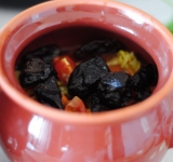 Затем чернослив, помидорки черри и зелень.