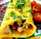 Заверните края омлета внутрь и подержите на огне еще одну минутку. При подаче посыпьте кинзой. Приятного аппетита!
Ссылка на источник рецепта: www.picantecooking.com/recipe/omlet-v-meksikanskom-stile