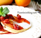 Горячие оладьи поливаем вишнево-мятным соусом и подаем к столу. Вкусные, нежные блинчики под превосходным, ярким соусом готовы! Отличного вам завтрака и хорошего дня!
Cсылка на оригинальный рецепт: www.picantecooking.com/recipe/tsitrusovye-tvorozhnye-oladi-s-vishnevo-myatnym-sousom